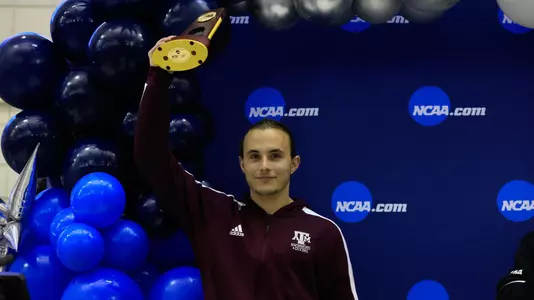 Kurtis Mathews on the podium after winning the 1-meter NCAA Championship