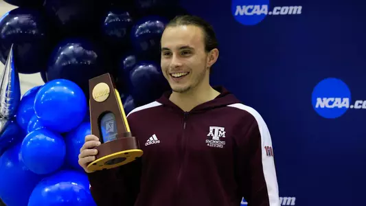 Kurtis Mathews on the podium after winning the 3-meter NCAA Championship