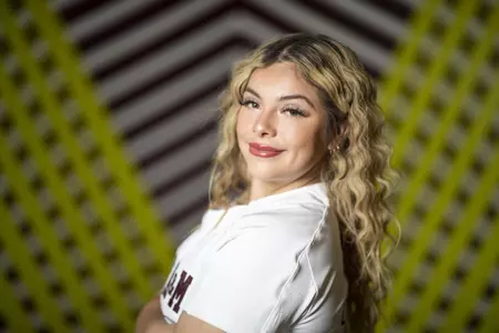 COLLEGE STATION, TX - January 20, 2022 - Infielder Hailey Gallegos #15 of the Texas A&M Aggies during Softball Photo Day in College Station, TX. Photo By Craig Bisacre/Texas A&M Athletics