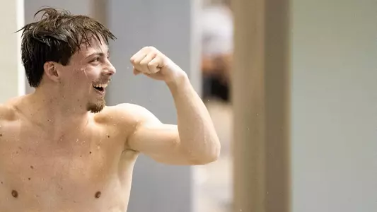 Victor Povzner celebrating his 1-meter performance at 2022 SECs
