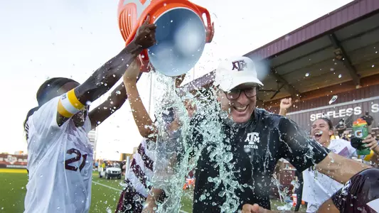 Coach Guerrieri receives a Gatorade shower courtesy of Karlina Sample as part of the Aggies' 2020 SEC regular-season title celebration