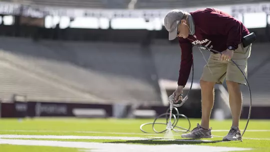 Craig Potts painting Kyle Field