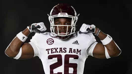 posed action photo of Demani Richardson on black background