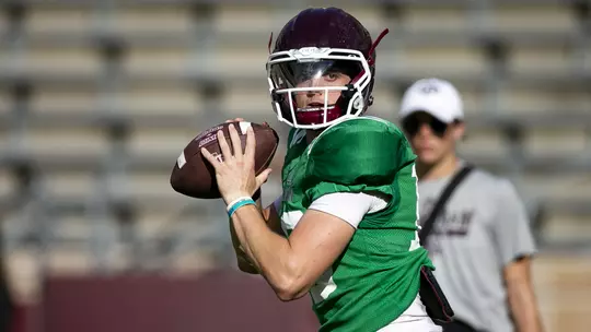 QB Haynes King about to throw a football in practice