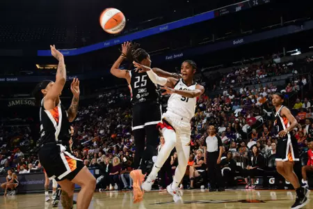PHOENIX, AZ - MAY 6: Sydney Colson #51 of the Las Vegas Aces passes the ball during the game against the Phoenix Mercury on May 6, 2022 at Footprint Center in Phoenix, Arizona. NOTE TO USER: User expressly acknowledges and agrees that, by downloading and or using this photograph, user is consenting to the terms and conditions of the Getty Images License Agreement. Mandatory Copyright Notice: Copyright 2022 NBAE (Photo by Kate Frese/NBAE via Getty Images)