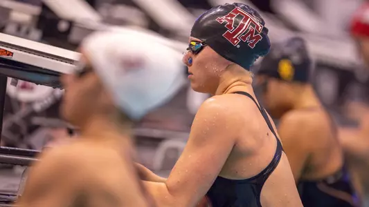 Jordan Buechler on the blocks swimming backstroke