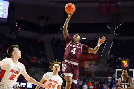 GAINESVILLE, FL - January 04, 2023 - Guard Wade Taylor IV #4 of the Texas A&M Aggies during the game between the Florida Gators and the Texas A&M Aggies at Stephen C. O'Connell Center in Gainesville, FL. Photo By Craig Bisacre
