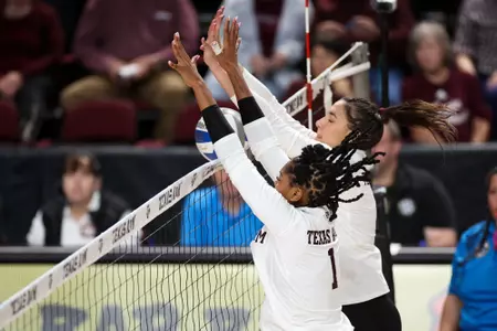 COLLEGE STATION, TX - October 15, 2023 - Middle Blocker Ifenna Cos-Okpalla #1 of the Texas A&M Aggies and Opposite Hitter Logan Lednicky #9 of the Texas A&M Aggies during the game between the South Carolina Gamecocks and the Texas A&M Aggies at Reed Arena in College Station, TX. Photo By Brendall O'Banon/Texas A&M Athletics
