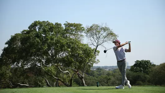 Jaime Montojo tees off in front of a Shady Oak tree at Shady Oaks Country Club