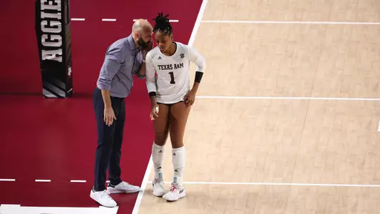 COLLEGE STATION, TX - October 20, 2023 - Middle Blocker Ifenna Cos-Okpalla #1 of the Texas A&M Aggies and Head Coach Jamie Morrison of the Texas A&M Aggies during the game between the Florida Gators and the Texas A&M Aggies at Reed Arena in College Station, TX. Photo By Craig Bisacre/Texas A&M Athletics