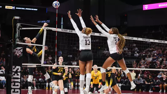 COLLEGE STATION, TX - October 01, 2023 - Outside Hitter Bianna Muoneke #13 of the Texas A&M Aggies and Middle Blocker Morgan Perkins #21 of the Texas A&M Aggies during the game between the Missouri Tigers and the Texas A&M Aggies at Reed Arena in College Station, TX. Photo By Craig Bisacre/Texas A&M Athletics