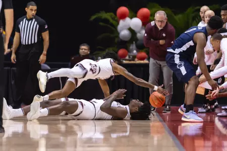 KISSIMMEE, FL - November 23, 2023 - Guard Eli Lawrence #5 of the Texas A&M Aggies and Forward Solomon Washington #13 of the Texas A&M Aggies during the game between the Penn State Nittany Lions and the Texas A&M Aggies at State Farm Field House at ESPN Wide World of Sports Complex in Kissimmee, FL. Photo By Craig Bisacre/Texas A&M Athletics
