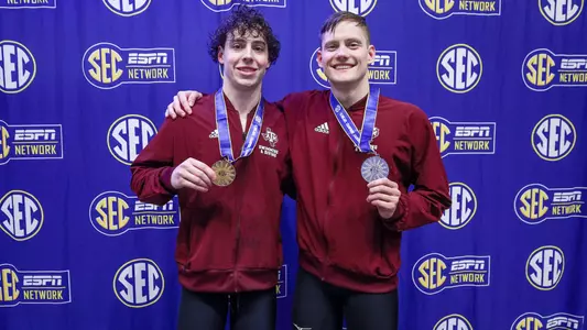Baylor Nelson nd Ante Fers Erzen on the medal stand after the 400 IM