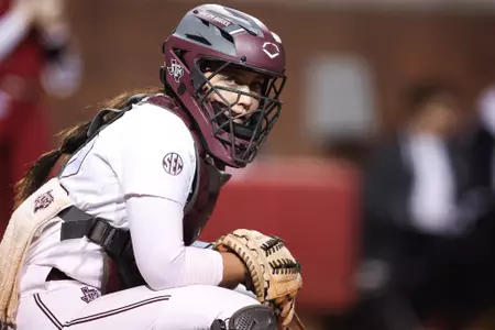FAYETTEVILLE, AR - March 10, 2023 - Catcher/Infielder Gracyn Coleman #22 of the Texas A&M Aggies during the game between the Arkansas Razorbacks and the Texas A&M Aggies at Bogle Park in Fayetteville, AR. Photo By Ethan Mito/Texas A&M Athletics