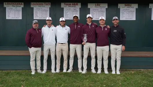 Coach Kortan, Sam Bennett, Daniel Rodrigues, Vishnu Sadagopan, Jaime Montojo, William Paysse and Coach Fast pose with the Louisiana Classics Trophy