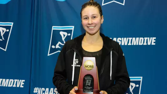 Chloe Stepanek on the podium at NCAA Championships after finishing seventh in the 200 free