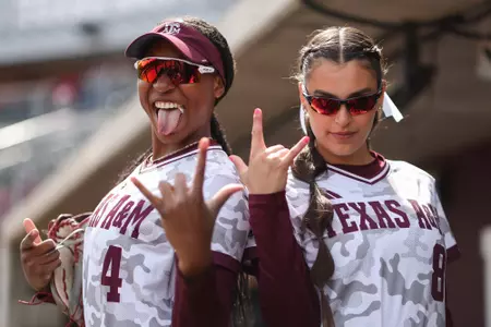COLLEGE STATION, TX - March 19, 2023 - Outfielder Bre Warren #4 of the Texas A&M Aggies and Pitcher/Outfielder Grace Uribe #8 of the Texas A&M Aggies during the game between the Georgia Bulldogs and the Texas A&M Aggies at Davis Diamond in College Station, TX. Photo By Evan Pilat/Texas A&M Athletics
