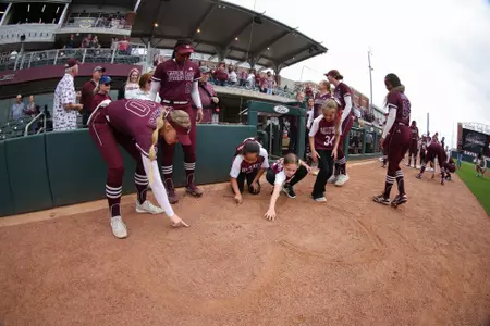 COLLEGE STATION, TX - March 29, 2023 - Pitcher Shaylee Ackerman #10 of the Texas A&M Aggies and Outfielder Morgan Smith #23 of the Texas A&M Aggies during the game between the Incarnate Word Cardinals and the Texas A&M Aggies at Davis Diamond in College Station, TX. Photo By Evan Pilat/Texas A&M Athletics