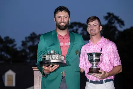 Masters champion Jon Rahm of Spain lifts the Masters Trophy alongside Amateur Sam Bennett of the United States with the Low Amateur Silver Cup during the Green Jacket ceremony following’ the final round of the 2023 Masters Tournament at Augusta National Golf Club, Sunday, April 9, 2023.