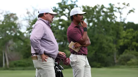 Head Coach Brian Kortan and Phichaksn Maichon analyze shot options