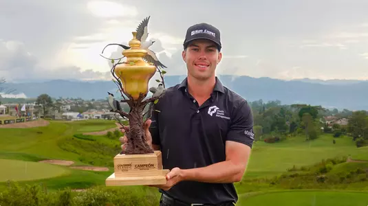 Walker Lee poses with the trophy from the Colombia Classic