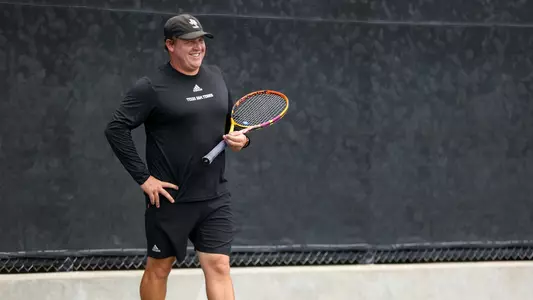 COLLEGE STATION, TX - May 05, 2023 - Assistant Coach Jordan Szabo of the Texas A&M Aggies during the game between the Quinnipiac Bobcats and the Texas A&M Aggies at Mitchell Tennis Center in College Station, TX. Photo By Aiden Shertzer/Texas A&M Athletics