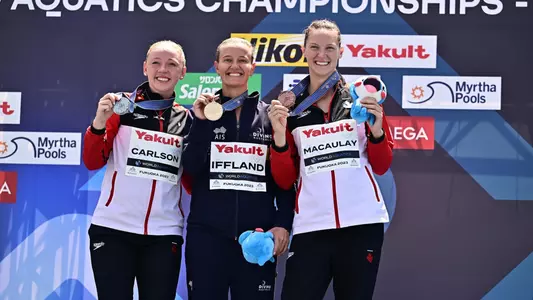 Jessica Macauley on the World Championships podium after earning bronze in the high dive.