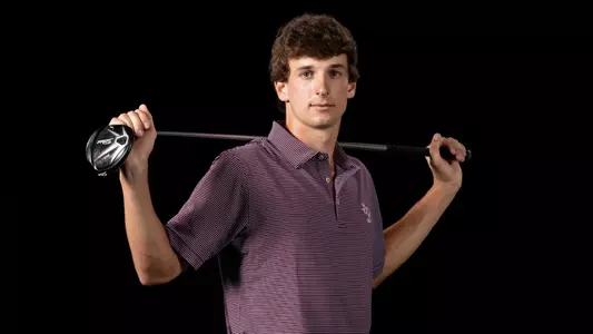 Jaime Montojo with the Bo Jackson pose with his golf club in front of a stark black background.