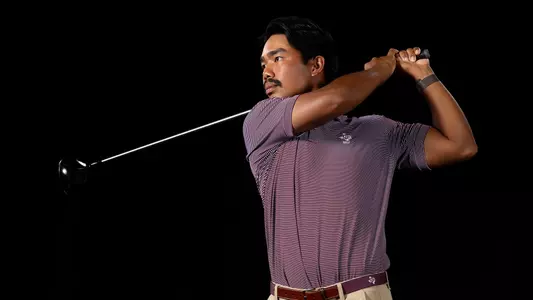 Phichaksn in a posed portrait shot holding his backswing while admiring a crushed drive