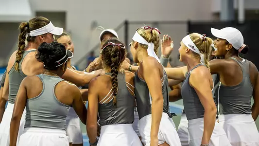 women's tennis team huddle