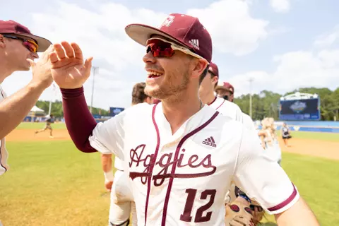 HOOVER, AL - May 27, 2023 - Infielder Austin Bost #12 of the Texas A&M Aggies during the game between the Arkansas Razorbacks and the Texas A&M Aggies at the Hoover Met in Hoover, Alabama. Photo By Rachel Mahan/Texas A&M Athletics