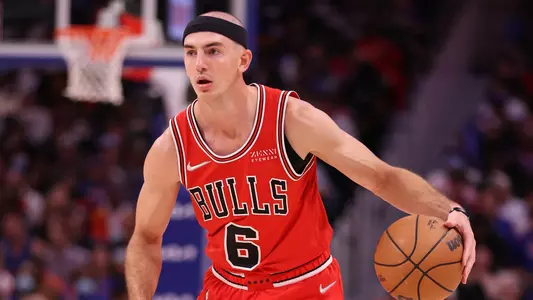 Alex Caruso dribbles while playing for the Chicago Bulls