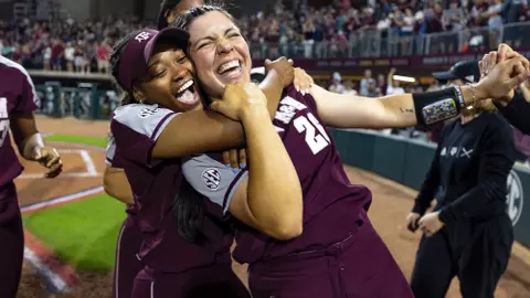 COLLEGE STATION, TX - April 23, 2022 - Infielder Trinity Cannon #26 of the Texas A&M Aggies and Infielder Koko Wooley #3 of the Texas A&M Aggies celebrate during the Softball game between the Alabama Crimson Tide and the Texas A&M Aggies at Davis Diamond in College Station, TX. Photo By Craig Bisacre/Texas A&M Athletics