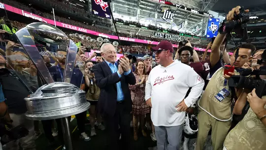 Mike Elko with Jerry Jones and the Southwest Classic Trophy