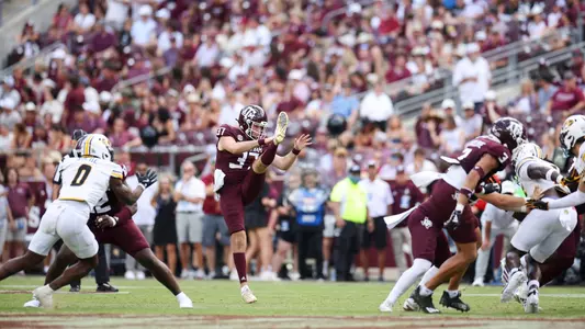 Tyler White punting the ball against Missouri
