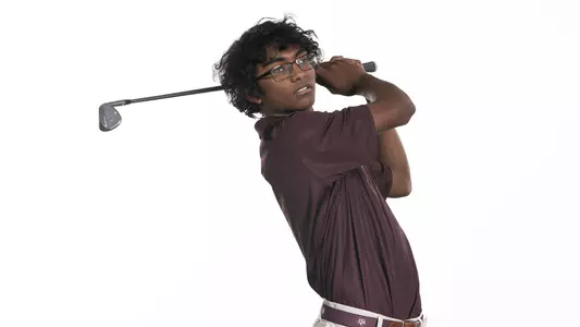 Shiv Parmar holds his follow through in his portrait shoot.