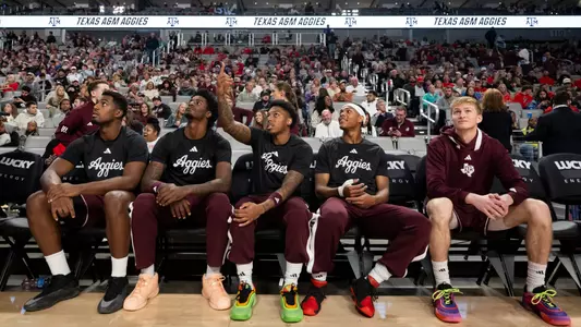 COLLEGE STATION, TX - December 08, 2024 - The Texas A&M Aggies Men's Basketball Team during the game between the Texas Tech Red Raiders and the Texas A&M Aggies at Dickies Arena in Fort Worth, TX. Photo By Wesley Bowers/Texas A&M Athletics