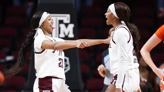 COLLEGE STATION, TX - December 04, 2024 - Guard Taliyah Parker #21 of the Texas A&M Aggies and Guard Janae Kent #20 of the Texas A&M Aggies during the game between the Syracuse Orange and the Texas A&M Aggies at Reed Arena in College Station, TX. Photo By Ethan Mito/Texas A&M Athletics