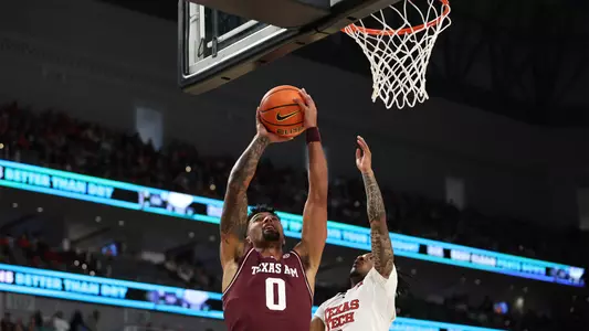 Jace Carter attacks the rim in the Aggies neutral court game against Texas Tech