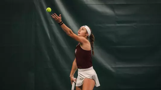 Mary Stoiana serving during a match