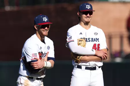 COLLEGE STATION, TX - February 18, 2024 - Infielder/Pitcher Blake Binderup #46 of the Texas A&M Aggies and Infielder/Outfielder Gavin Grahovac #9 of the Texas A&M Aggies during the game between the McNeese St. Cowboys and the Texas A&M Aggies at Blue Bell Park in College Station, TX. Photo By Sydney Morriss/Texas A&M Athletics