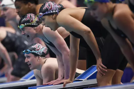 AUBURN, AL - February 23, 2024 - Bobbi Kennett of the Texas A&M Aggies, Olivia Theall of the Texas A&M Aggies and Miranda Grana of the Texas A&M Aggies during the SEC Swimming and Diving Championships game at James e. Martin Aquatics Center in Auburn, AL. Photo By Ethan Mito/Texas A&M Athletics