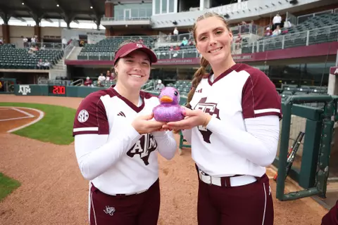 COLLEGE STATION, TX - February 09, 2024 - Emily Leavitt #25 of the Texas A&M Aggies and Emiley Kennedy #11 of the Texas A&M Aggies during the game between the Valparaiso Crusaders and the Texas A&M Aggies at Davis Diamond in College Station, TX. Photo By Evan Pilat/Texas A&M Athletics