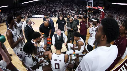 Team huddle during timeout versus Missouri