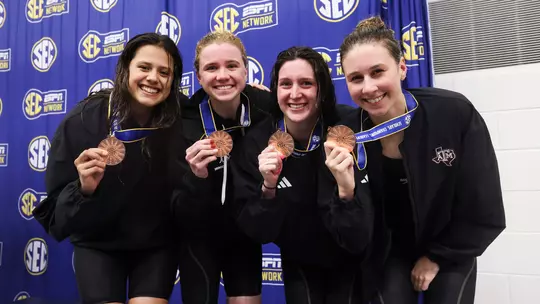 Miranda Grana, Bobbi Kennett, Olivia Theall and Chloe Stepanek of the Texas A&M Aggies during the SEC Swimming and Diving Championships game at James e. Martin Aquatics Center in Auburn, AL. Photo By Ethan Mito/Texas A&M Athletics