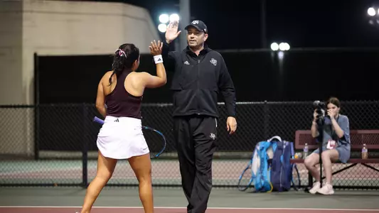 COLLEGE STATION, TX - March 01, 2024 - Head Coach Mark Weaver of the Texas A&M Aggies during the game between the South Carolina Gamecocks and the Texas A&M Aggies at Mitchell Tennis Center in College Station, TX. Photo By Sydney Morriss/Texas A&M Athletics