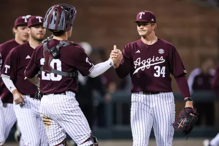 COLLEGE STATION, TX - March 26, 2024 - Pitcher Josh Stewart #34 of the Texas A&M Aggies and Catcher Jackson Appel #20 of the Texas A&M Aggies during the game between the Houston Christian Huskies and the Texas A&M Aggies at Blue Bell Park in College Station, TX. Photo By Ethan Mito/Texas A&M Athletics
