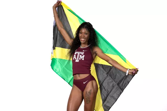 Lamara Distin dons the Jamaican national flag.