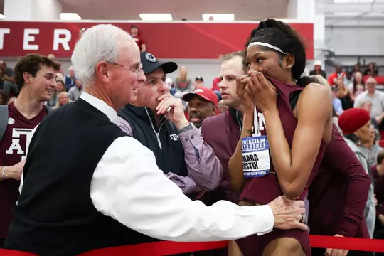 The coaches congratulate Lamara Distin.