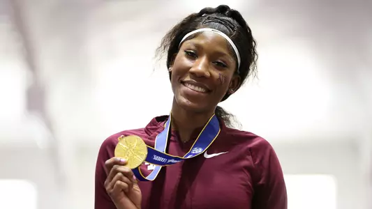 Lamara Distin poses with her 2024 SEC Indoor high jump medal.